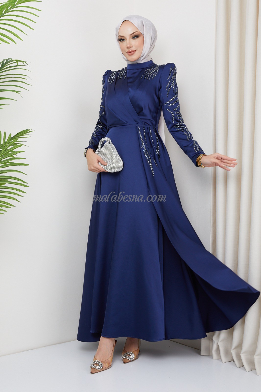 Dark blue evening dress with attached skirt with shining stones